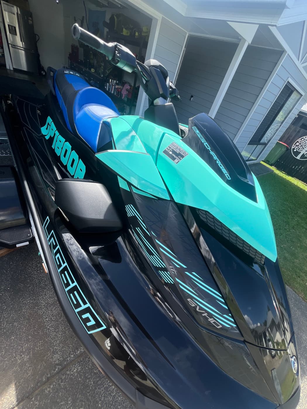 Teal and black jet ski wrap