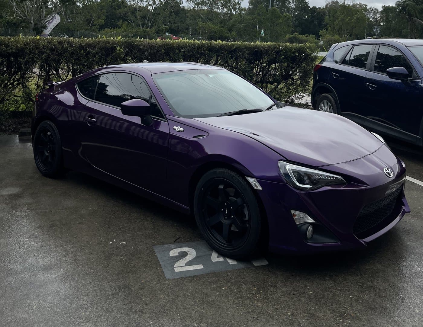 Deep purple full vinyl wrap on a coupe