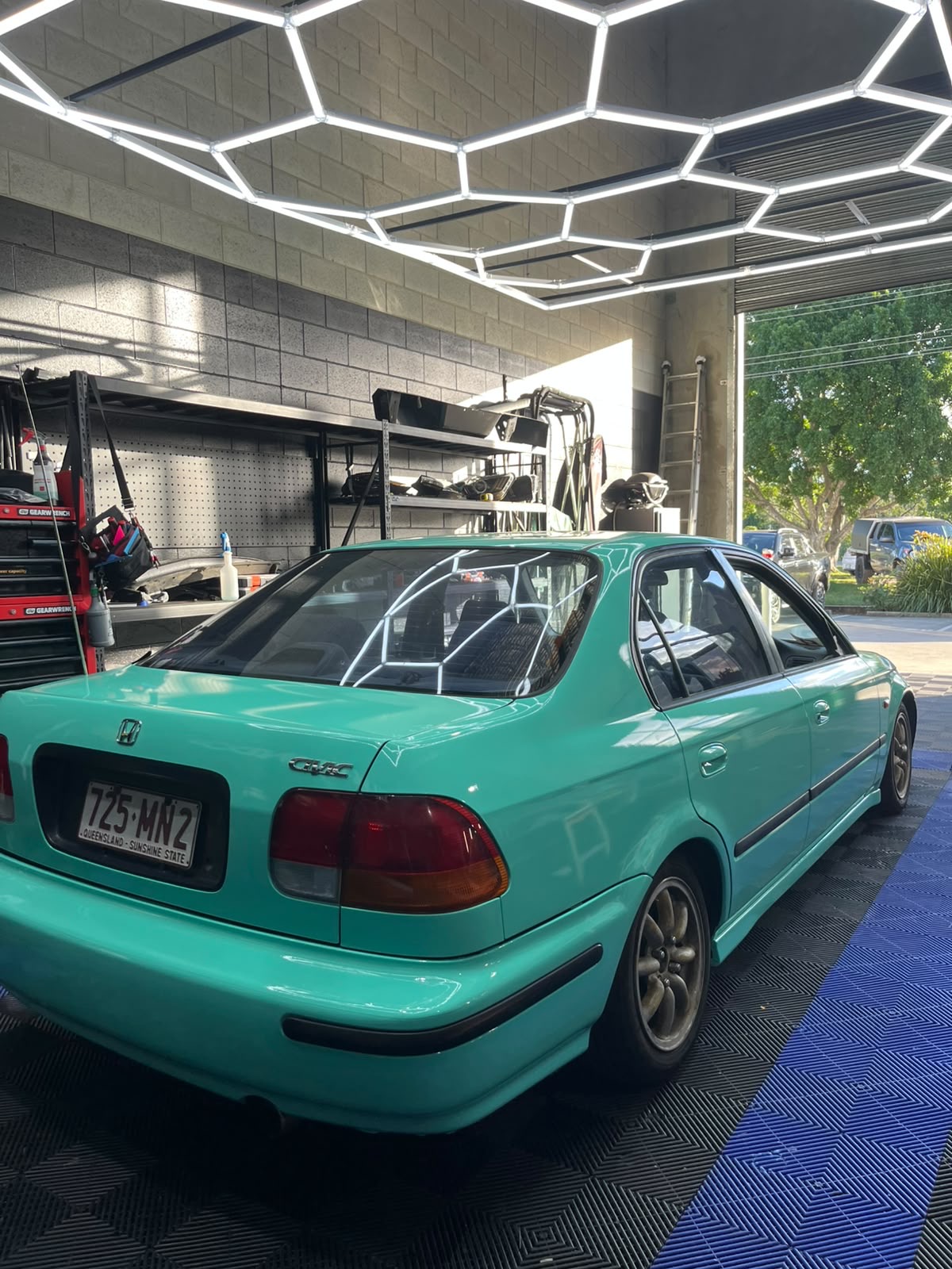 Teal green Honda Civic colour-change wrap in the studio